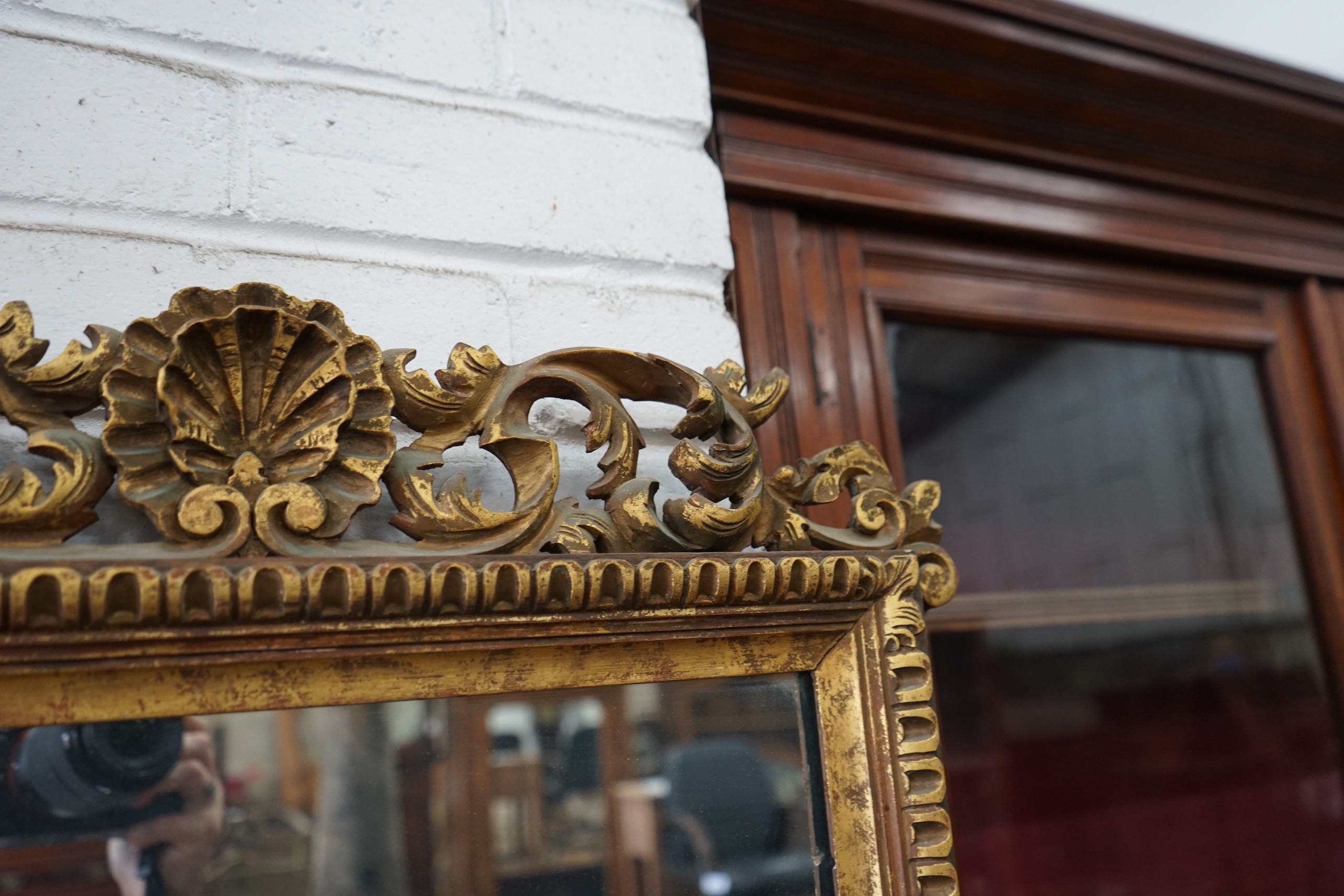 An 18th century style giltwood wall mirror, width 57cm, height 94cm